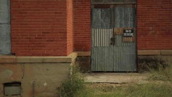 No trespassing sign on abandoned building video