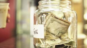 Money in tip jar video