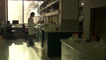 dolly in on scientist in a lab video