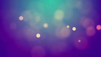 Clear bokeh lights fading and floating on emerald and purple background video