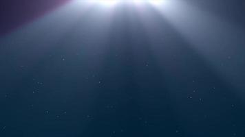 Little particles on calm waves of the dark sea with clear flares from the top