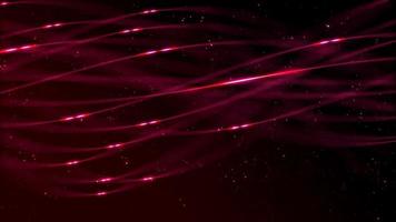 Red glowing lines and particles floating and spinning on dark background video