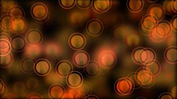 warme Bokeh-Lichter mit dünnem Ring, der langsam auf 4k dunklem Hintergrund schwimmt video