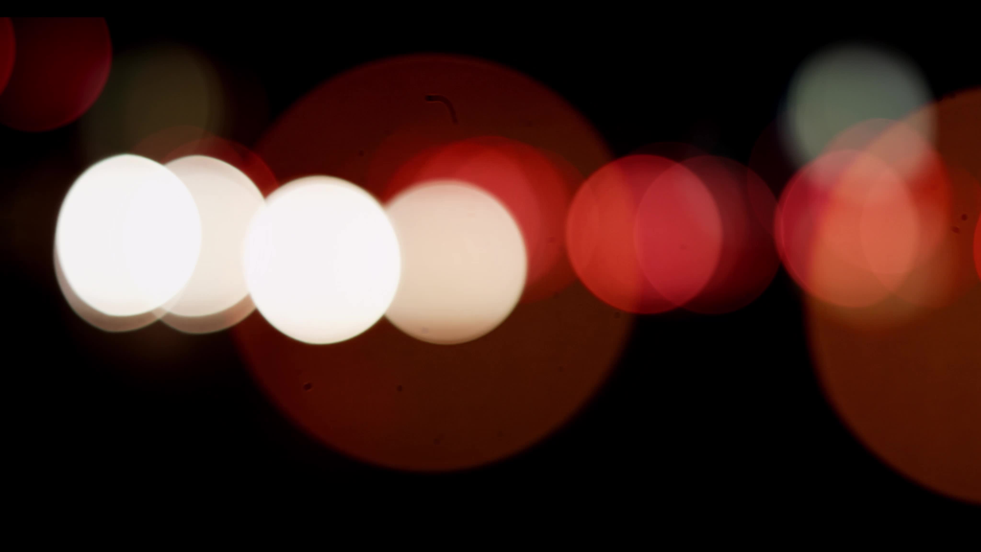 Bokeh lights of vehicles circulating in both directios and different ...