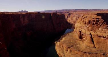 Slow panning shot of the river inside the red canyon in 4K