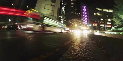 Time lapse at floor level of vehicles driving on the street in 4K video