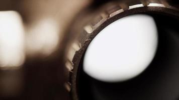 Extreme close up of 8mm movie projector and a detail of the lamp and the shadow of the film in 4K video