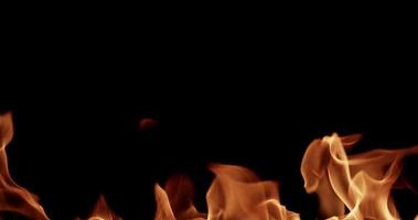 Science template of fire topic with warm flames on dark background in 4K slow motion video