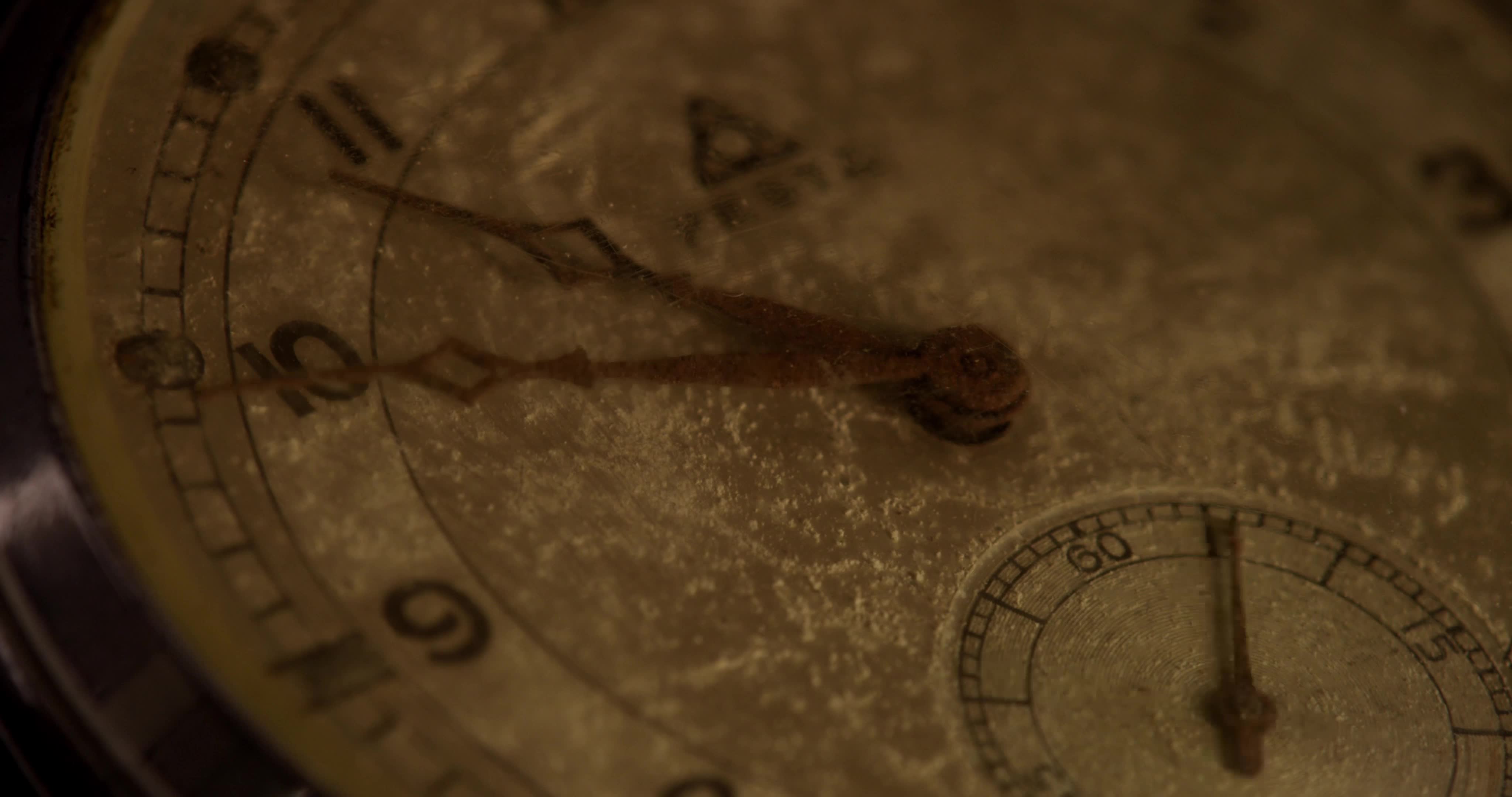 Extreme close up shot of clock hands moving from 1045 to 1115 in 4K