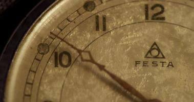 Extreme close up shot of minutes clock hand moving twenty minutes, starting in minute 49 in 4K time lapse video