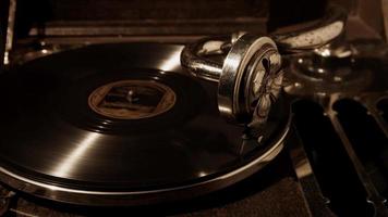 Close up shot of old record player working with big vynil disc in 4K video