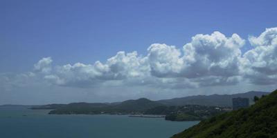 Time lapse of boats near a port town with beautiful clouds moving fast in 4K video