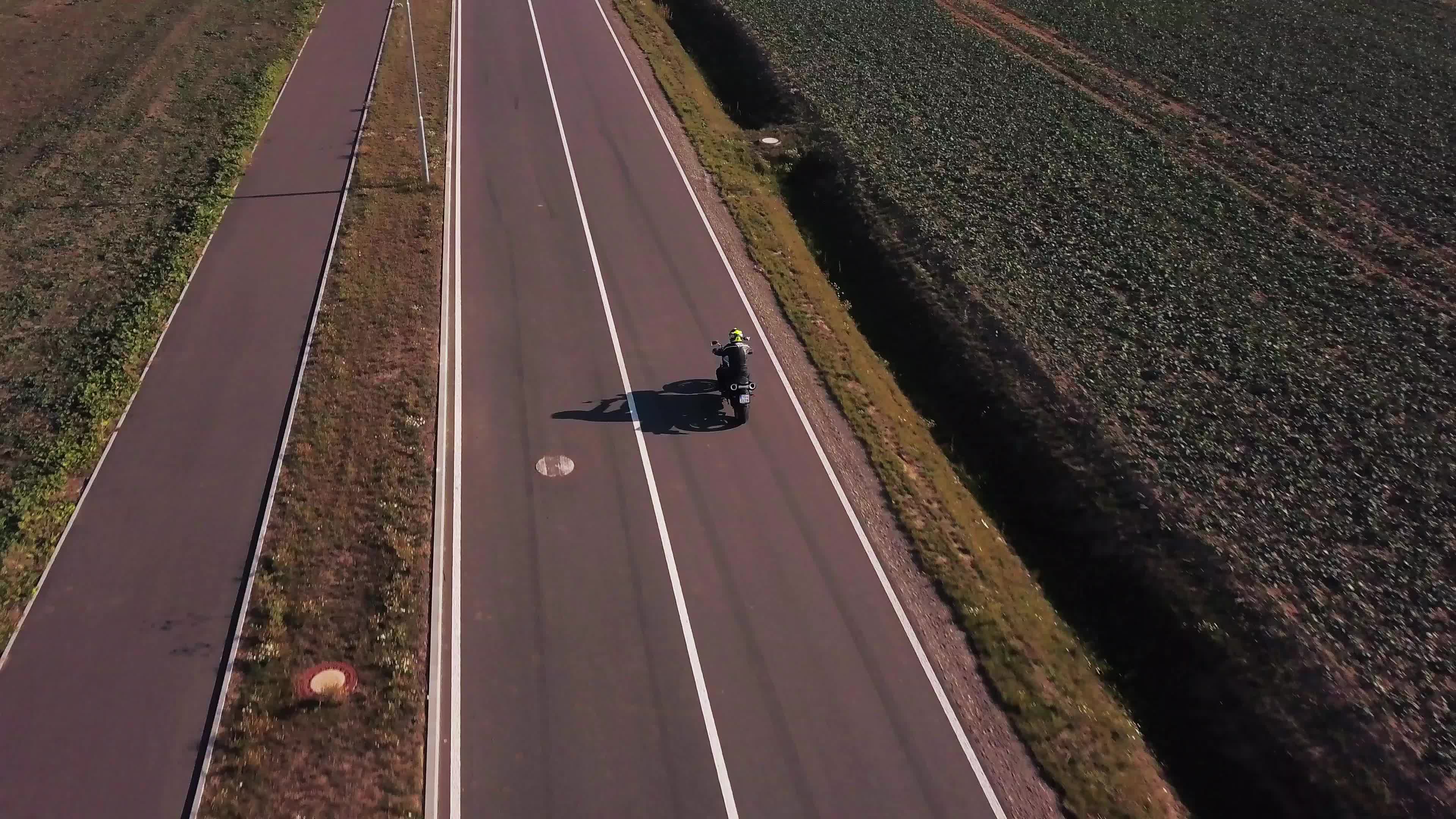 Drone follows a motorbike from back in 4K 1617211 Stock Video at Vecteezy