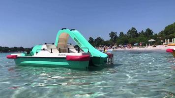 Paddle boat on the beach in 4K video