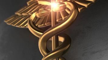 hälsovård koncept. gyllene medicinsk caduceus symbol video