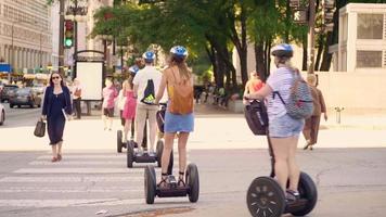 People On Segways Crossing The Street In Chicago video