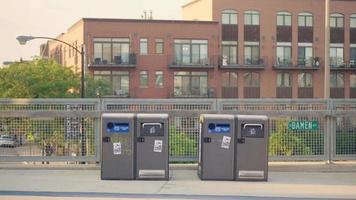 Runners And Cyclists On Footbridge With Trash Containers video