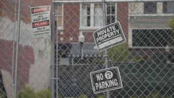 Close Up Of Iron Grid Door With Warning Signs video