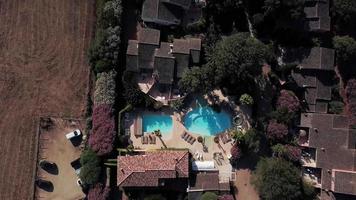 Flying above villas on a sunny day in Corsica in 4K video