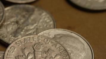 Rotating stock footage shot of American dimes coin - 0.10 - MONEY 0207 video