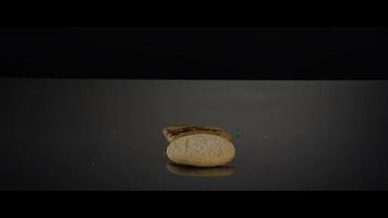 Falling cookies from above onto a reflective surface - COOKIES 240 video