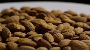 Cinematic, rotating shot of almonds on a white surface - ALMONDS 036 video
