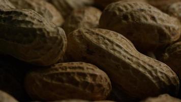 Cinematic, rotating shot of peanuts on a white surface - PEANUTS 031 video