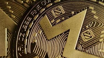 Rotating shot of Bitcoins (digital cryptocurrency) - BITCOIN MONERO 100