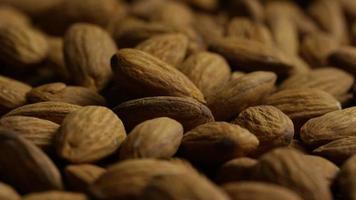 Cinematic, rotating shot of almonds on a white surface - ALMONDS 037 video
