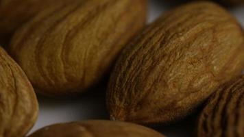 Cinematic, rotating shot of almonds on a white surface - ALMONDS 010 video