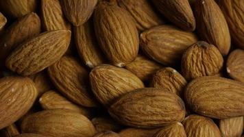 Cinematic, rotating shot of almonds on a white surface - ALMONDS 020 video
