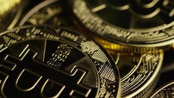 Rotating shot of Bitcoins digital cryptocurrency - BITCOIN 0557 video
