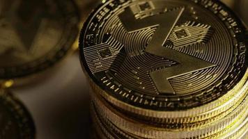 Rotating shot of Bitcoins digital cryptocurrency - BITCOIN MONERO 143 video