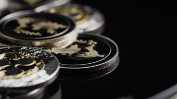 Rotating shot of Bitcoins digital cryptocurrency - BITCOIN RIPPLE 0193 video