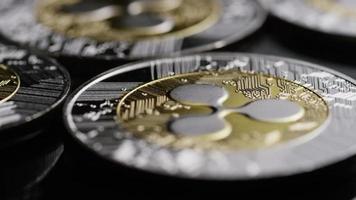 Rotating shot of Bitcoins digital cryptocurrency - BITCOIN RIPPLE 0099 video