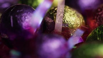 Rotating shot of colorful Easter candies on a bed of easter grass - EASTER 223 video