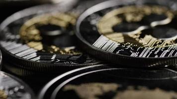 Rotating shot of Bitcoins digital cryptocurrency - BITCOIN RIPPLE 0194 video