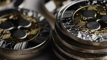 Rotating shot of Bitcoins digital cryptocurrency - BITCOIN RIPPLE 0072 video