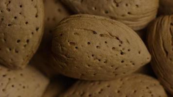 Cinematic, rotating shot of almonds on a white surface - ALMONDS 124 video