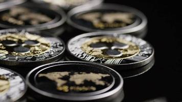 Rotating shot of Bitcoins digital cryptocurrency - BITCOIN RIPPLE 0173 video