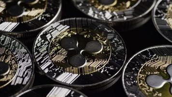 Rotating shot of Bitcoins digital cryptocurrency - BITCOIN RIPPLE 0093 video