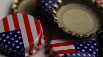 Rotating shot of bottle caps with the American flag printed on them - BOTTLE CAPS 036 video