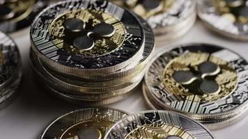 Rotating shot of Bitcoins digital cryptocurrency - BITCOIN RIPPLE 0071 video