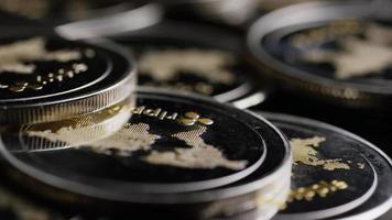 Rotating shot of Bitcoins digital cryptocurrency - BITCOIN RIPPLE 0157 video