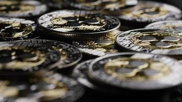 Rotating shot of Bitcoins (digital cryptocurrency) - BITCOIN RIPPLE 0120 video