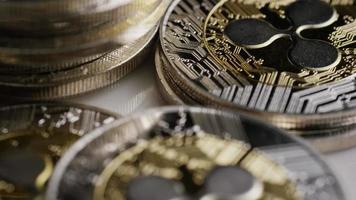 Rotating shot of Bitcoins digital cryptocurrency - BITCOIN RIPPLE 0073 video
