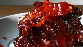 BBQ sauce pouring and splashing in ultra slow motion 1,500 fps onto BBQ ribs - BBQ PHANTOM 077 video