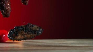 Smoked chicken wings falling and bouncing in ultra slow motion 1,500 fps - CHICKEN WINGS PHANTOM 035 video