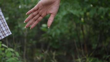 Close up hand of the father holding the daughter hand in slow motion scene video