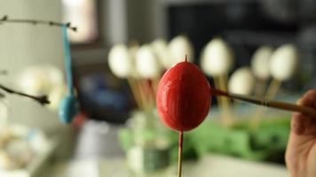 Young child painting easter eggs video